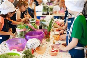 Kid chefs using herbs for cooking class